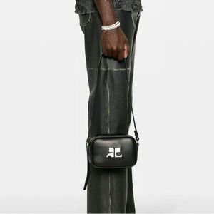 Black Leather Crossbody Bag with White Logo Accent from Courreges.